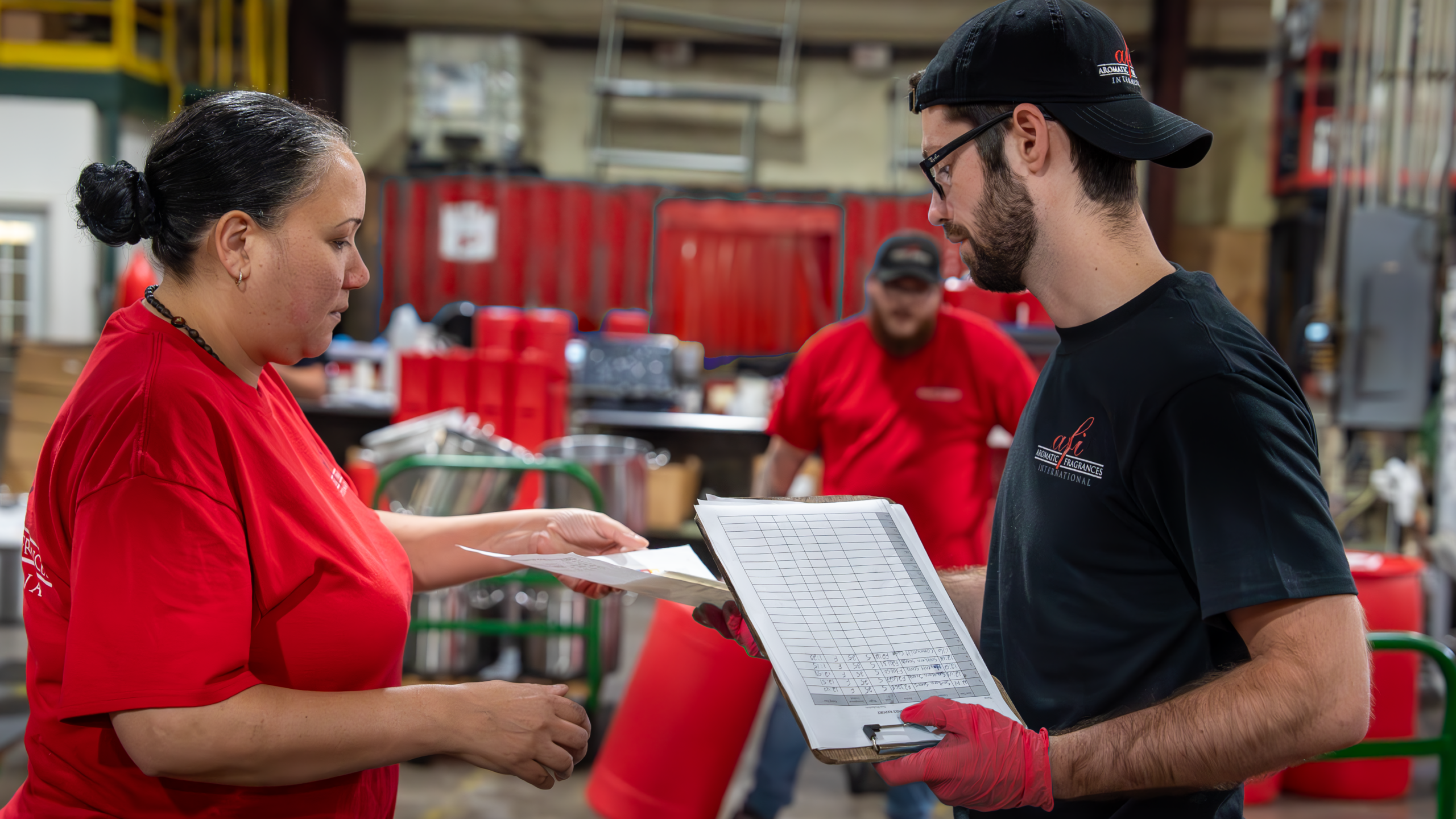 AFI compounders preparing large batches of custom fragrances